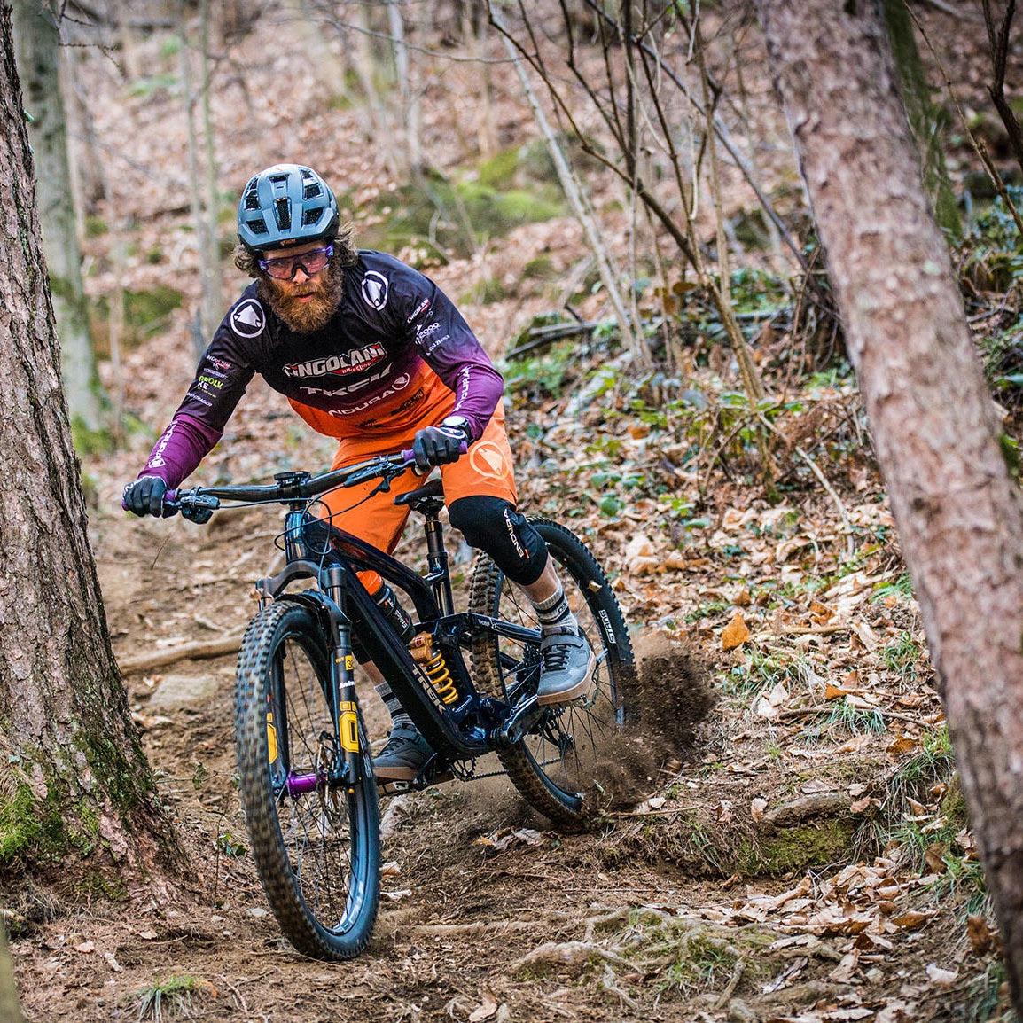 man riding a mtb in the forest