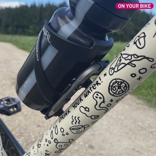 Multitool attached to a bike with bottle cage and bottle