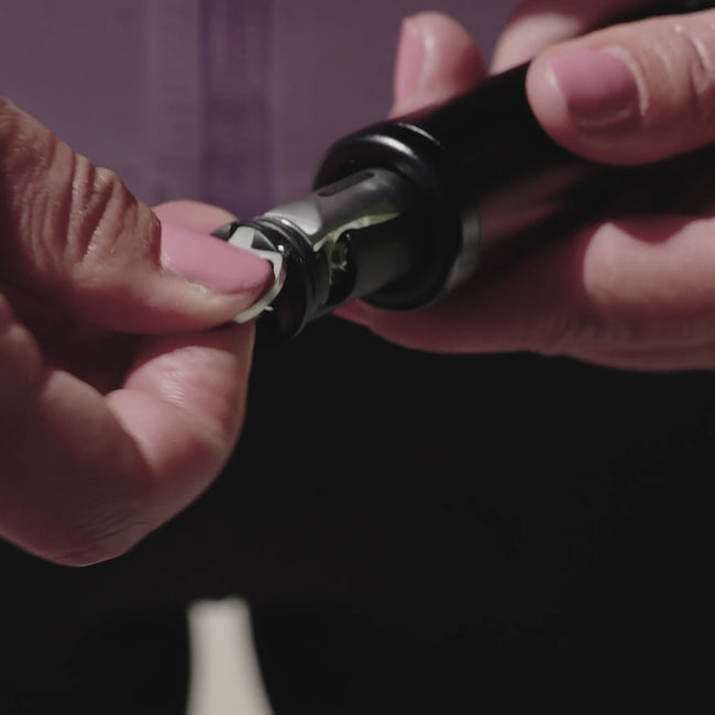 Person holding a bicycle pump and a tool